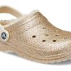 Crocs klassiska glitterfodrade träskor ”Gold White” 205842-93S